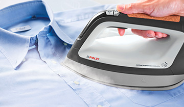 The image shows the soleplate of Polti Vaporella Instant on a shirt